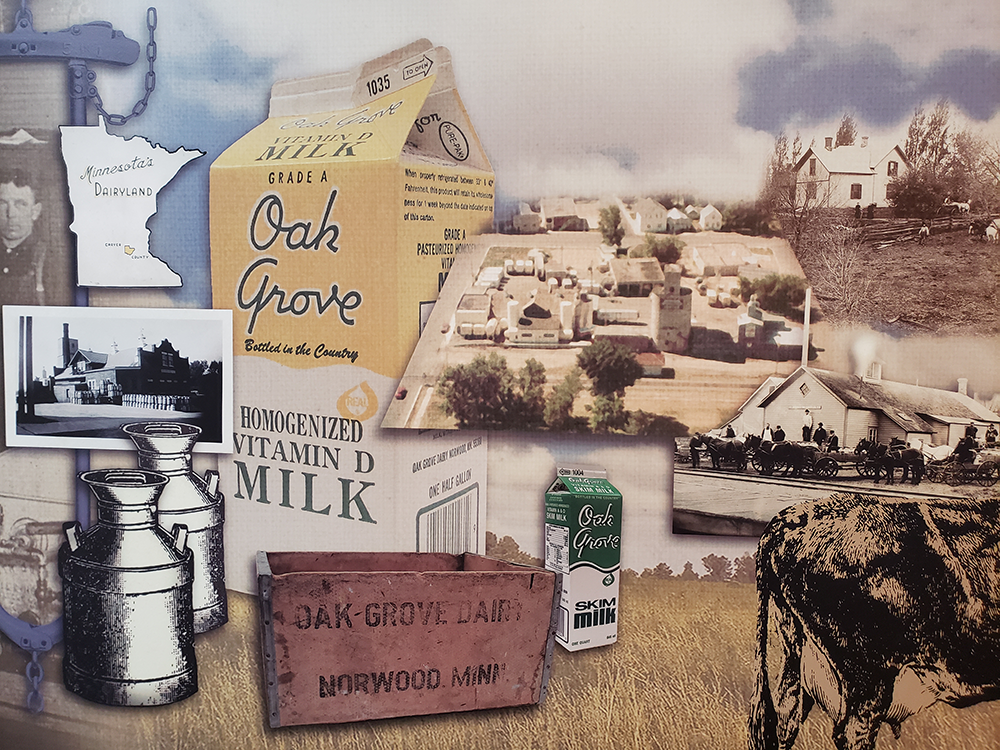 mural of milk bottle crate, milk cartons, cows, and dairyland